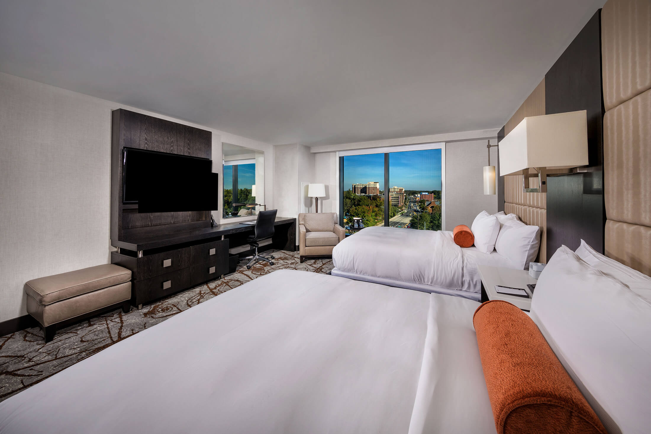 standard two queen beds with TV and dresser